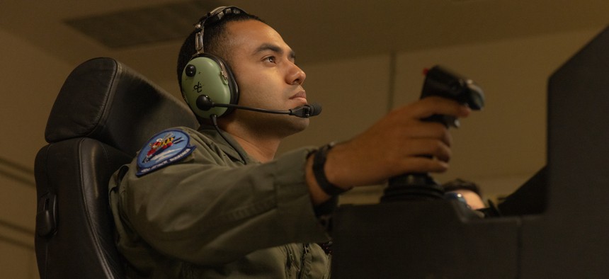 U.S. Air Force Staff Sgt. Mykel Barela, an MQ-9 Reaper drone instructor pilot assigned to Marine Aviation Weapons and Tactics Squadron One, pilots an MQ-9 Reaper drone during unmanned aerial system tactics training part of Weapons and Tactics Instructor course 2-24, at Laguna Army Airfield, Arizona, March. 26, 2024. 