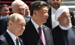 In this 2019 photo, Russian President Vladimir Putin, Chinese President Xi Jinping and then-president of Iran Hassan Rouhani walk as they attend a meeting of the Shanghai Cooperation Organisation Council of Heads of State. 