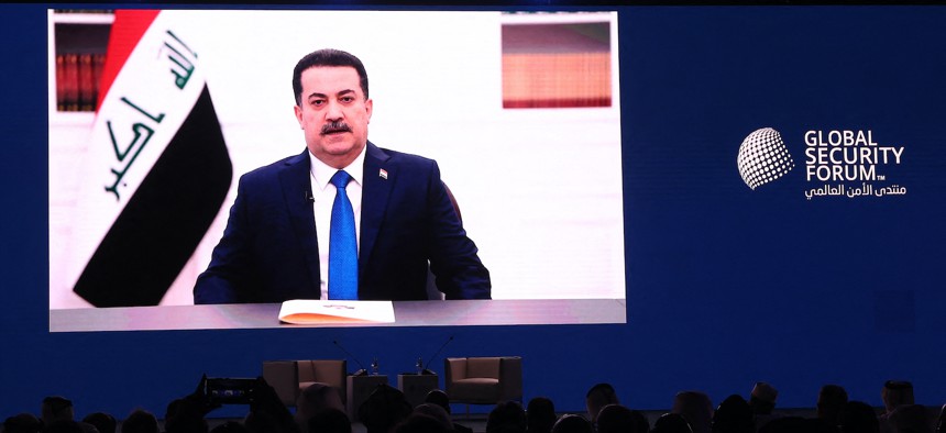 Iraqi Prime Minister Mohamed Shia al-Sudani addresses the opening session of the Global Security Forum in Doha via video link from Baghdad on May 20, 2024. 
