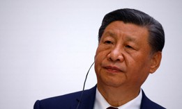 China's President Xi Jinping looks on during a joint statement with the French President as part of the Chinese president's two-day state visit in France, in Paris.