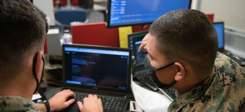 In this 2021 photo, U.S. Marines with Marine Corps Cyberspace Warfare Group, Cyber Protection Team 651, compete in the Marine Corps "Capture the Flag" Cyber Games 2021 at Fort Meade, Maryland.