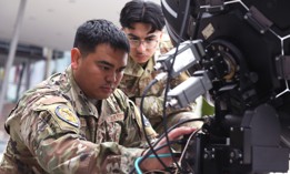 Air Force Staff Sgt. Javin Delgado, a electronic warfare specialist with the Hawaii Air National Guard’s 154th Wing, prepares to calibrate electronic warfare equipment as Senior Airman Osmar Mendoza, a space systems operator with the California Air National Guard's 216th Electromagnetic Warfare Squadron, looks on during Vulcan Guard Bolt 6, Ramstein Air Base, Germany, March 27, 2024. 