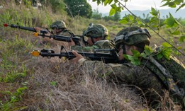 Philippines Army soldiers with the 7th Infantry Division scan the horizon for enemy forces during an air assault maneuver as part of the Joint Pacific Multinational Readiness Center-Exportable (JPMRC-X) exercise on Fort Magsaysay, Philippines, June 1, 2024. 