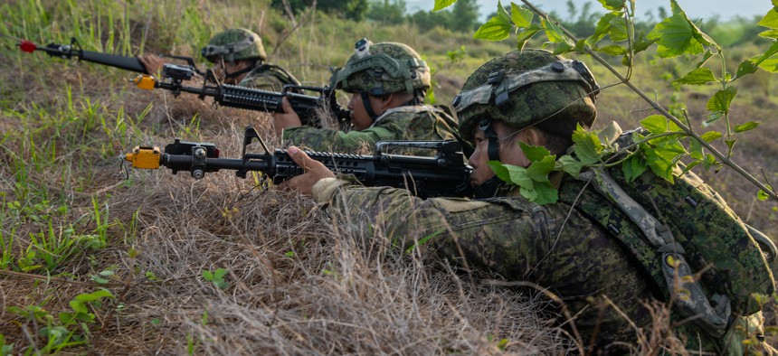 Philippines Army soldiers with the 7th Infantry Division scan the horizon for enemy forces during an air assault maneuver as part of the Joint Pacific Multinational Readiness Center-Exportable (JPMRC-X) exercise on Fort Magsaysay, Philippines, June 1, 2024. 