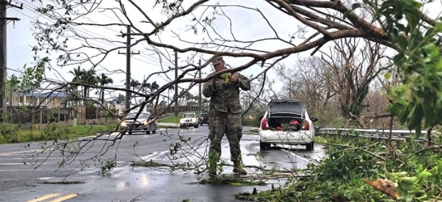 A U.S. Army soldier cleares trees downed when Typhoon Mawar struck Guam in May 2023.
