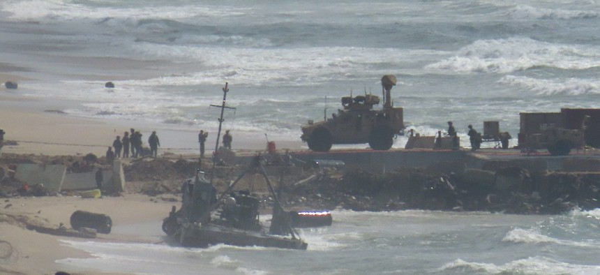 In this image from May 27, 2024, the damaged pier is shown floating in the water after operations were suspended because of adverse weather conditions and rising sea levels in Gaza.