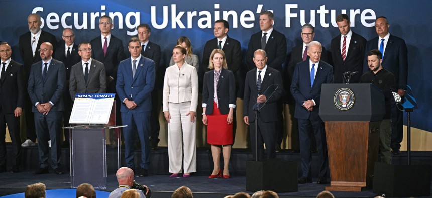 U.S. President Joe Biden listens to Ukraine's President Volodymyr Zelensky speak during the NATO Summit in Washington, D.C., on July 11, 2024.