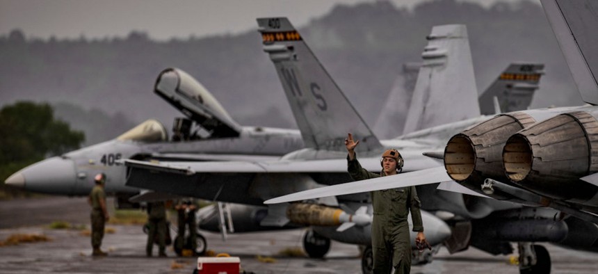 U.S. Marines prepare F/A-18 Hornet fighter jets as they take part in the bi-annual Marine Aviation Support Activity (MASA) 23 at the airport of a former U.S. naval base on July 13, 2023, in Subic Bay, Philippines.