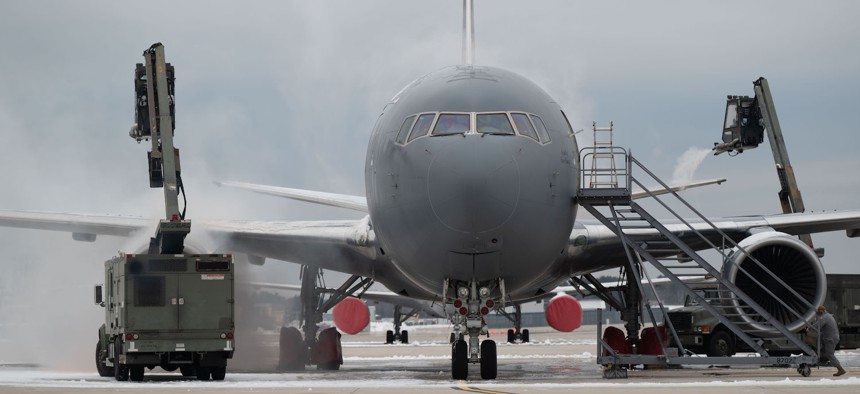 Maintainers with the 157th Maintenance Group deice a KC-46 Pegasus before take off Jan. 31, 2024 at Pease Air National Guard Base, New Hampshire.