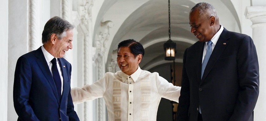 Philippines' President Ferdinand Marcos Jr. (C) talks to US Secretary of State Antony Blinken (L) and US Secretary of Defense Lloyd Austin during a courtesy visit at the Malacanang Palace in Manila on July 30, 2024. 