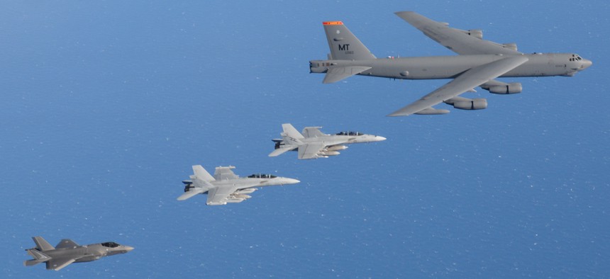 A Royal Australian Air Force EA-18G Growler, a F/A-18F Super Hornet and a F-35A Lightning fly alongside a United States Air Force B-52 Stratofortress during Exercise Talisman Sabre 2021.