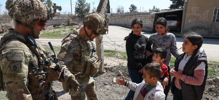 U.S. soldiers assigned to Comanche Troop, 1st Brigade, 4th Infantry Division, in Northeast Syria on March 16, 2022. 