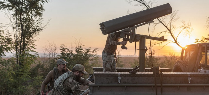 Ukrainian soldiers prepare a vehicle adapted to fire helicopter shells as the Russia-Ukraine war continues in the direction of Toretsk, Ukraine, August 19, 2024.