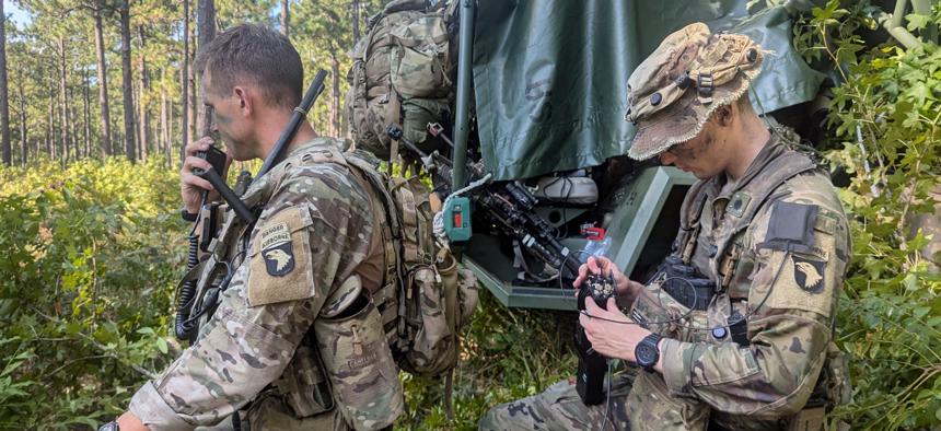 A soldier from the 101st Airborne's multifunctional reconnaissance company (left) operates the Bal Chatri drone detector in the Joint Readiness Training Ground Exercise. 