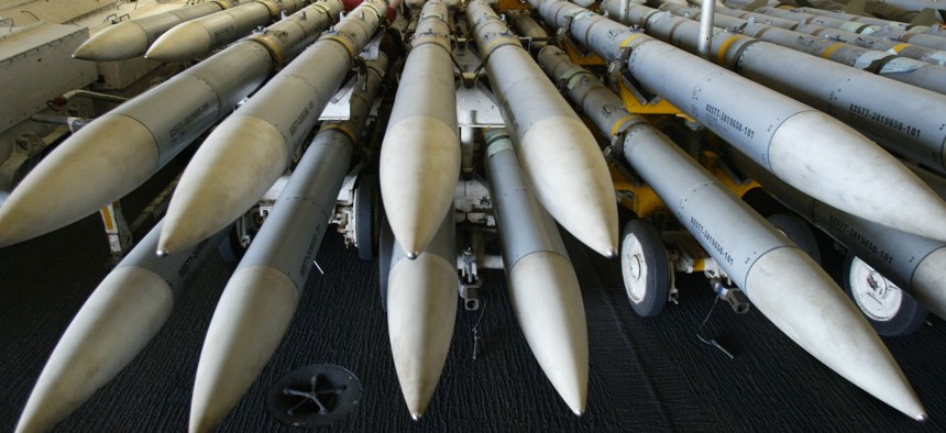 In this 2003 photo, Advanced Medium Range Air-to-Air Missiles are stacked in the hangar bay of the USS Kitty Hawk.