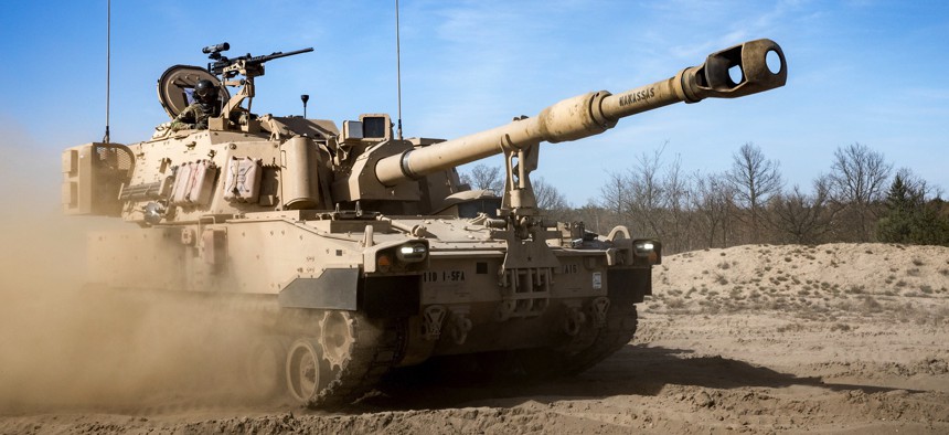 U.S. Army soldiers conduct maneuvers in a Paladin howitzer before artillery certifications in Torun, Poland.