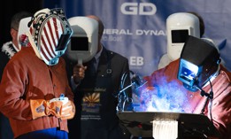 A welder helps weld a steel plate to be mounted on the Virginia-class fast-attack submarine USS Arizona (SSN 803) at General Dynamics Electric Boat's Quonset Point facility in North Kingstown, Rhode Island. 