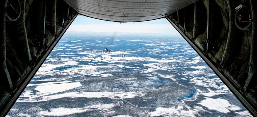 A Swedish Gripen jet (L) and a Finnish F-18 Hornet take part in joint exercises between the two air forces over the Arctic Circle towns of Jokkmokk in Sweden and Rovaniemi in Finland on March 25, 2019. 