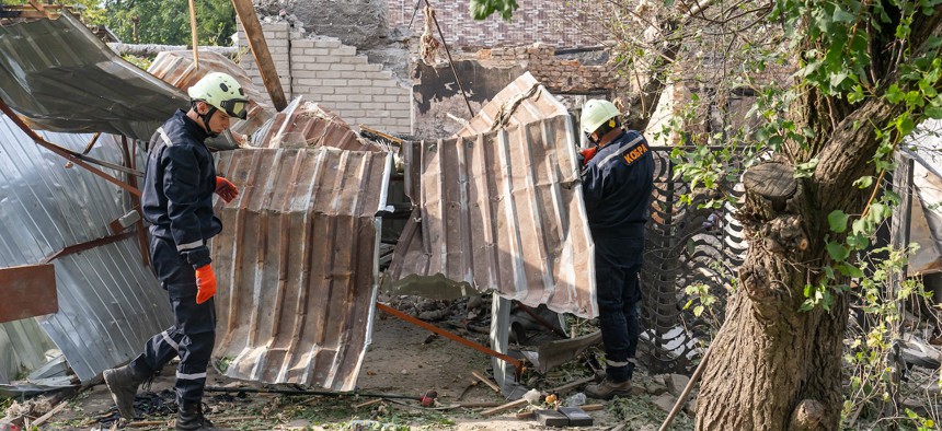 Firefighters work in damaged houses after drone attacks carried out by Russian forces in the Zaporizhzhia region overnight on August 27, 2024 in Ukraine. 