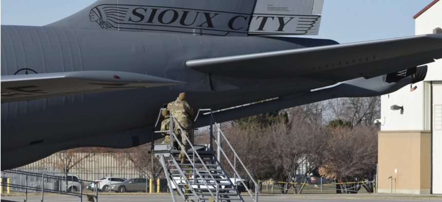 In this 2013 photo, crew chiefs at the Iowa Air National Guard perform maintenance on a U.S. Air National Guard KC-135 Stratotanker.