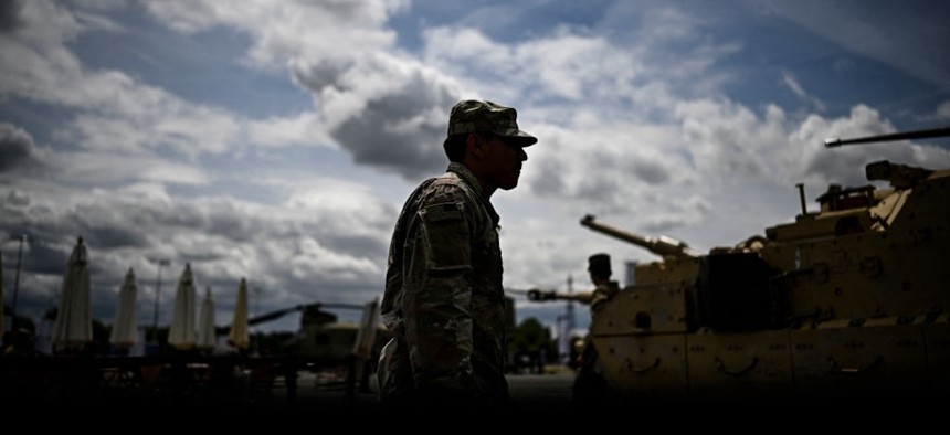 A US Marine takes in the Eurosatory defense show outside Paris in 2024.