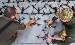 Ukrainian soldiers inspect first-person-view drones built by volunteers as one-way kamikaze weapons on September 13, 2024, in Lviv, Ukraine.