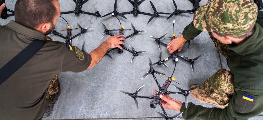 Ukrainian soldiers inspect first-person-view drones built by volunteers as one-way kamikaze weapons on September 13, 2024, in Lviv, Ukraine.