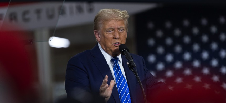 GOP presidential nominee Donald Trump speaks on Oct. 1, 2024, in Waunakee, Wisconsin, where he reiterated that U.S. troops who received Purple Hearts for injuries sustained in a 2020 Iranian missile attack merely suffered "headaches."