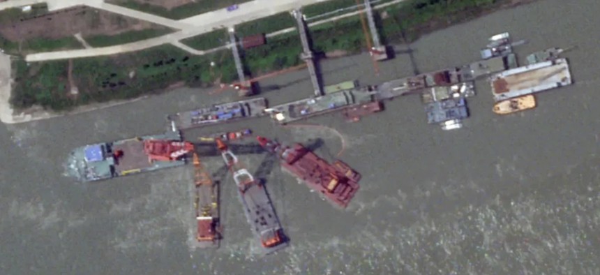 Barge-mounted cranes work at Wuchang Shipyard on the Yangtze River just outside the city of Wuhan in June 2024.