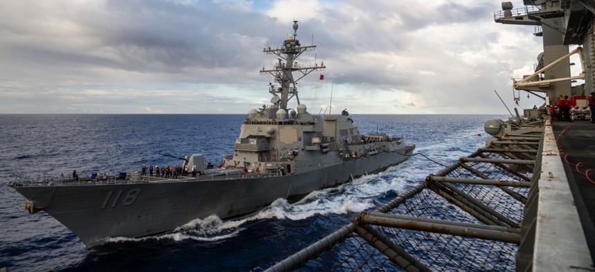 The guided-missile destroyer USS Daniel Inouye (DDG 118) takes on fuel from the aircraft carrier USS Theodore Roosevelt (CVN 71) on Oct. 2, 2024, two days before putting into its homeport of Pearl Harbor, Hawaii.