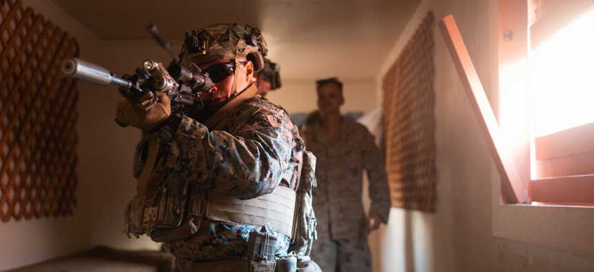 A U.S. Marine with 3d Littoral Combat Team, 3d Marine Littoral Regiment, 3d Marine Division, conducts a close-quarter battle test during a squad competition at Marine Corps Base Hawaii, Oct. 3, 2024. 