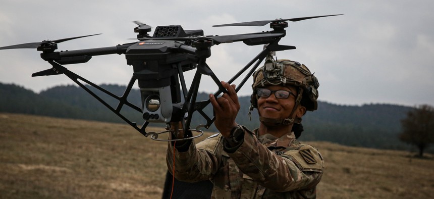 U.S. Army Sgt. Claudia Kinney, assigned to the 6th Squadron, 8th Cavalry Regiment, retrieves a drone during Allied Spirit 24 at the Hohenfels Training Area, Joint Multinational Readiness Center, Germany, March 6, 2024.