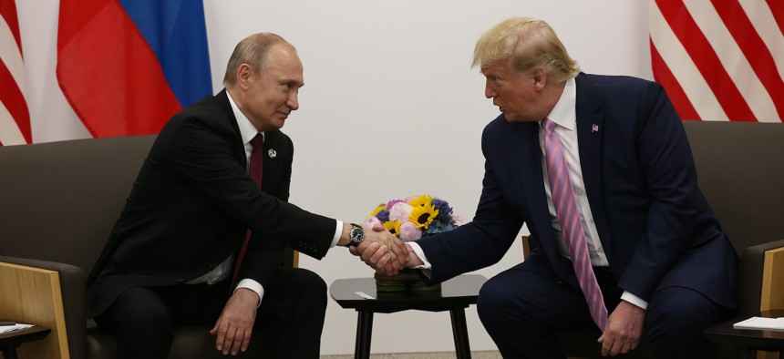 Donald Trump (R) and Russian President Vladimir Putin (L) attend their bilateral meeting at the G20 Osaka Summit 2019, in Osaka, Japan.