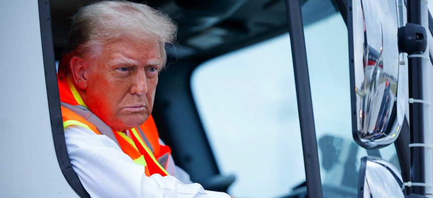 GOP presidential nominee Donald Trump holds a press conference from a trash truck in Green Bay, Wisconsin, on October 30, 2024.