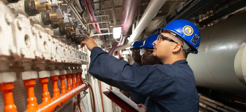 Sailors assigned to the Nimitz-class aircraft carrier USS John C. Stennis (CVN 74) check air control valves aboard Stennis in Newport News, Virginia, Oct. 17, 2024. 