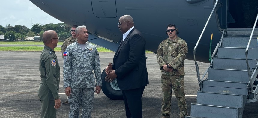 U.S. Defense Secretary Lloyd Austin steps off his plane on the Philippine island of Palawan.