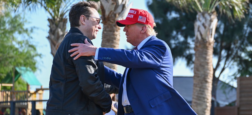 BROWNSVILLE, TEXAS - NOVEMBER 19: U.S. President-elect Donald Trump greets Elon Musk as he arrives to attend a viewing of the launch of the sixth test flight of the SpaceX Starship rocket on November 19, 2024 in Brownsville, Texas. SpaceX’s billionaire owner, Elon Musk, a Trump confidante, has been tapped to lead the new Department of Government Efficiency alongside former presidential candidate Vivek Ramaswamy.