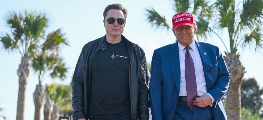 U.S. President-elect Donald Trump greets Elon Musk as he arrives to attend a viewing of the launch of the sixth test flight of the SpaceX Starship rocket on November 19, 2024 in Brownsville, Texas. 