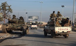 Anti-regime fighters patrol in Aleppo on December 2, 2024. Over the weekend, the Islamist Hayat Tahrir al-Sham (HTS) group and allied factions took most of the northern Syrian city. 