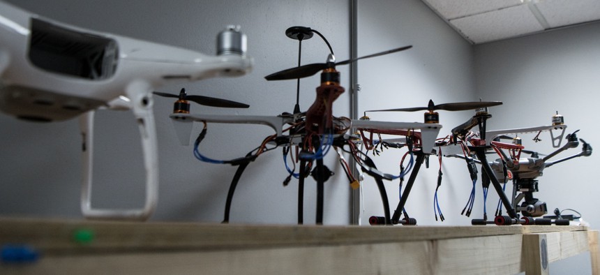 In this 2020 photo, a variety of small drone models rest on a shelf in the 379th Expeditionary Security Forces Squadron counter-small unmanned aerial systems program office at Al Udeid Air Base, Qatar. 