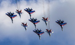 Russian Air Force MiG-29 and Su-27 fighter jets perform at an air show outside Moscow on July 20, 2021. 