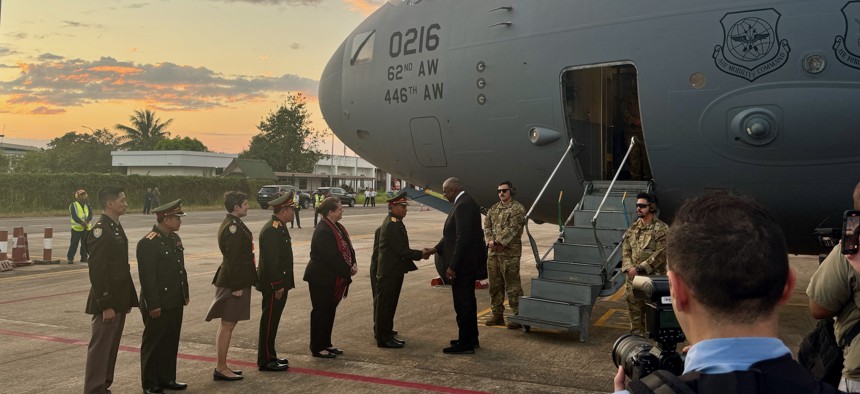 U.S. Defense Secretary Lloyd Austin is greeted upon his arrival in Vientiane, Laos, on Nov. 19, 2024.