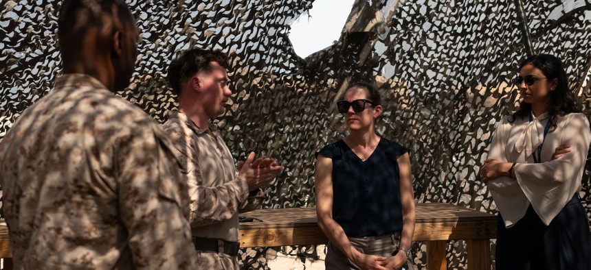 U.S. Marines assigned to Combined Joint Task Force-Horn of Africa talk to Maureen Farrell, deputy assistant secretary of defense for African affairs, third from left, at Camp Lemonnier, Djibouti, Sept. 9, 2024.