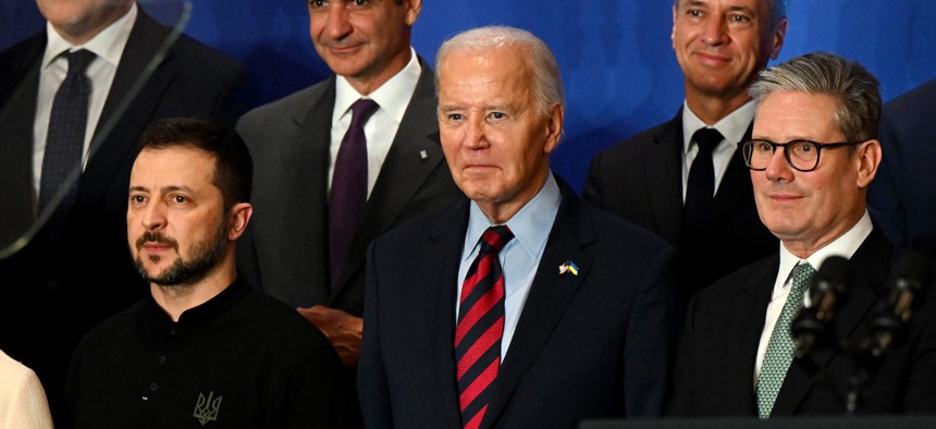 Ukraine President Volodymyr Zelensky (L), U.S. President Joe Biden (C) and British Prime Minister Keir Starmer (R) pose for a photo at an event concerning the recovery and reconstruction of Ukrainian at the United Nations on September 25, 2024, in New York.