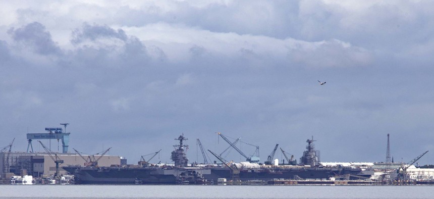 USS Gerald R. Ford (CVN 78) prepares to moor next to Pre-Commissioning Unit John F. Kennedy (CVN 79) at Newport News Shipyard, Virginia, on Aug. 20, 2021. 