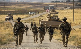 Soldiers with the U.S. Army's 1st Armored Division make their way to an oil production facility in Syria to meet with its management team on Oct. 27, 2020.