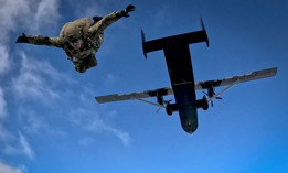 A Navy explosive ordnance disposal technician conducts a free-fall parachute operation during a training exercise in Suffolk, Va., April 4, 2024.