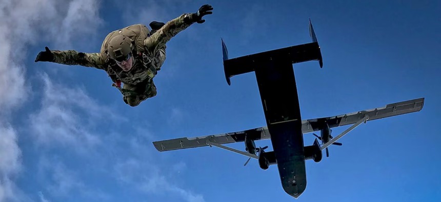 A Navy explosive ordnance disposal technician conducts a free-fall parachute operation during a training exercise in Suffolk, Va., April 4, 2024.