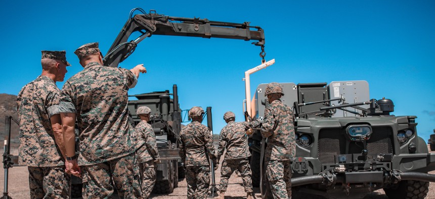 Marine Commandant Gen. Eric Smith observes Marines with 3rd Marine Littoral Combat Team, 3rd Marine Littoral Regiment, perform a loading drill of a Navy/Marine Expeditionary Ship Interdiction System on Marine Corps Base Hawaii, Sept. 12, 2024.