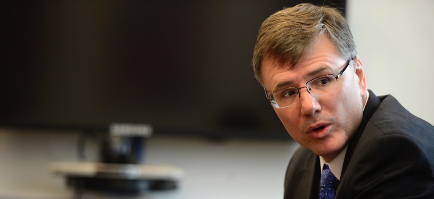 Troy Meink, then-deputy Air Force undersecretary for space, answers questions during a space budget briefing at the Pentagon on March 5, 2015.